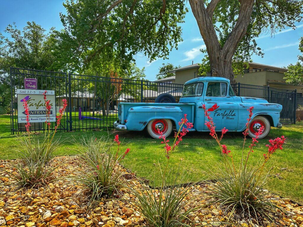 Blue Farfalla Wines truck by iron gate